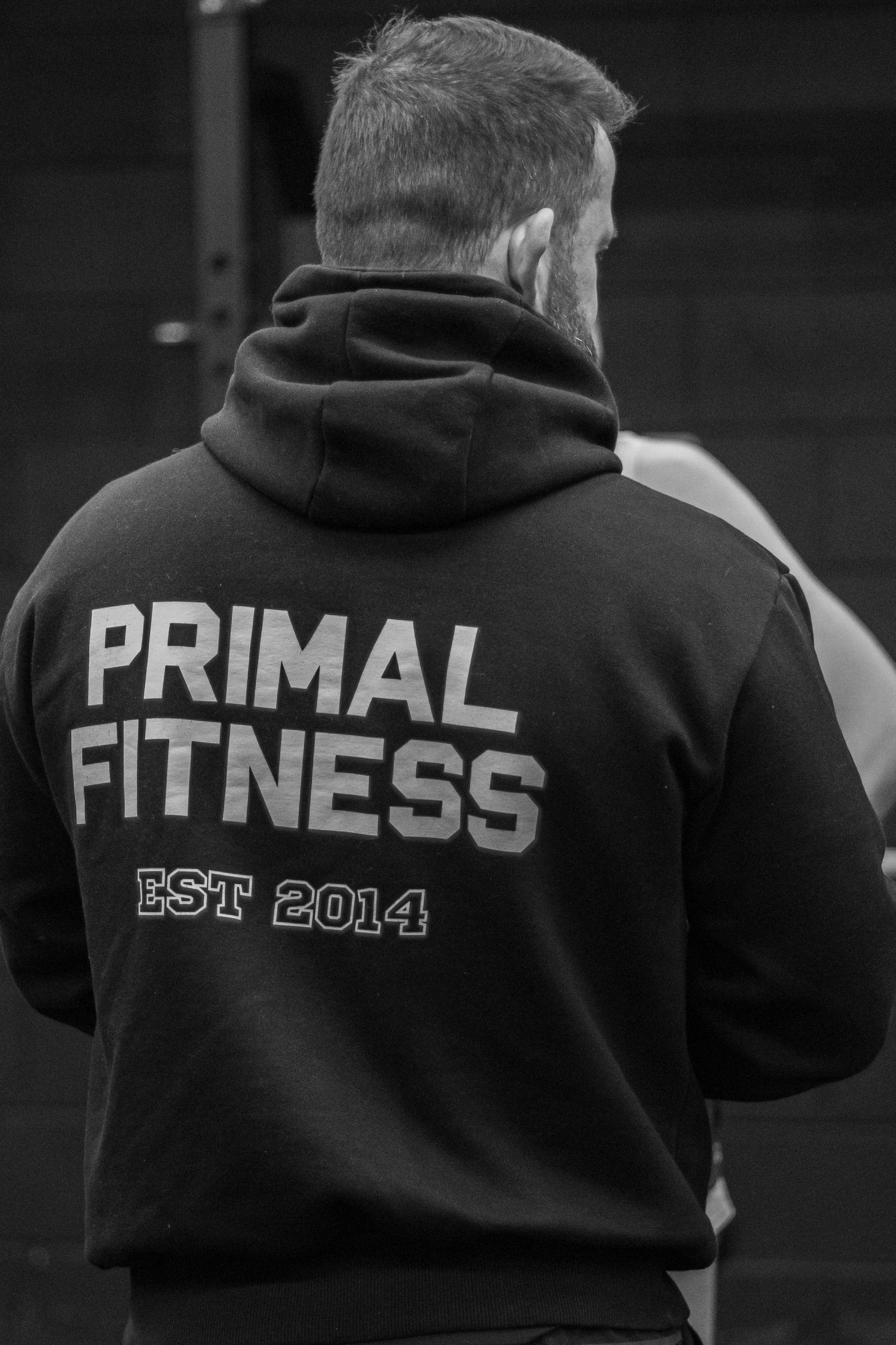 A Primal coach seen from behind, PRIMAL FITNESS EST 2014 on the hoodie