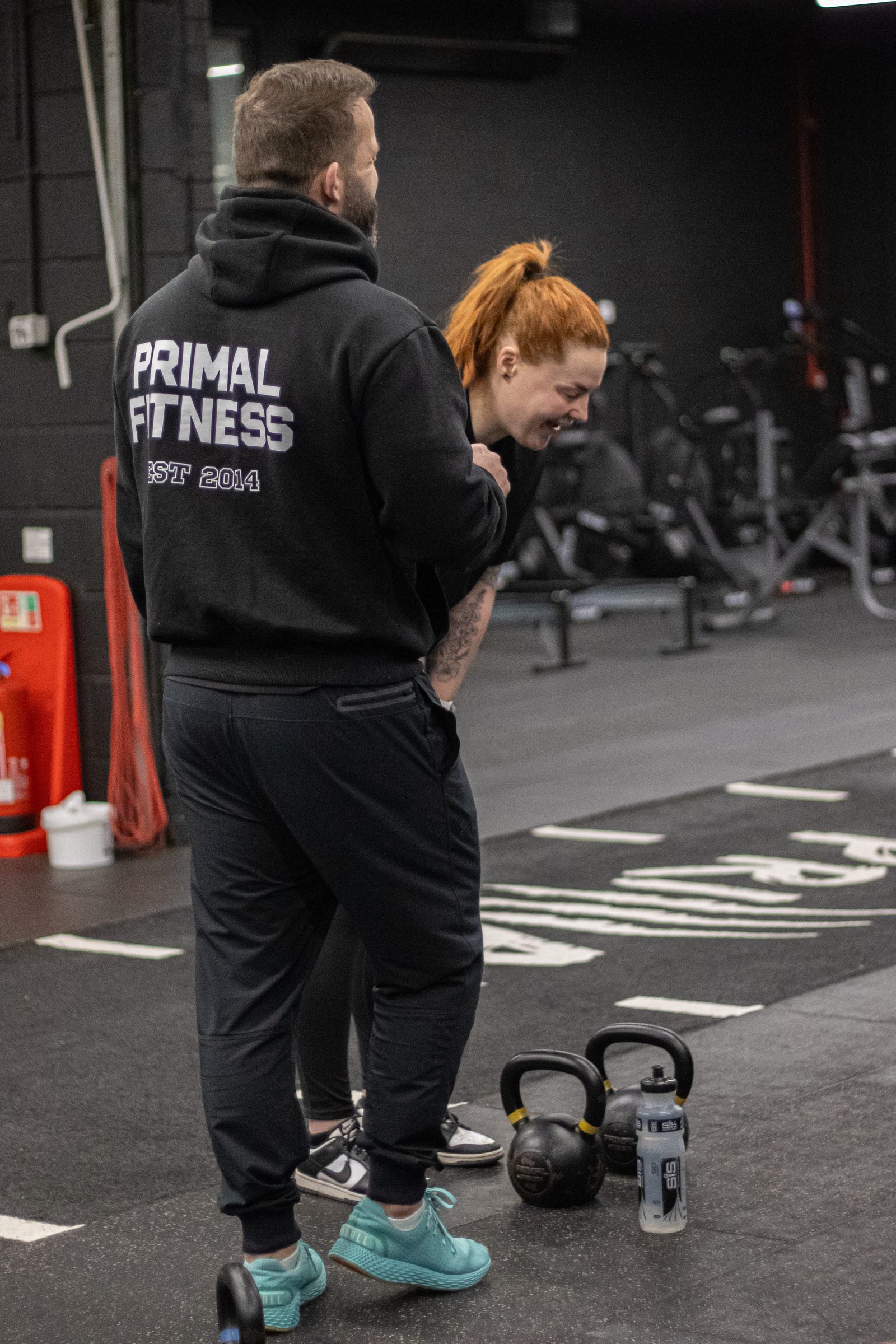 A Primal personal trainer coaching a member at the kettlebells