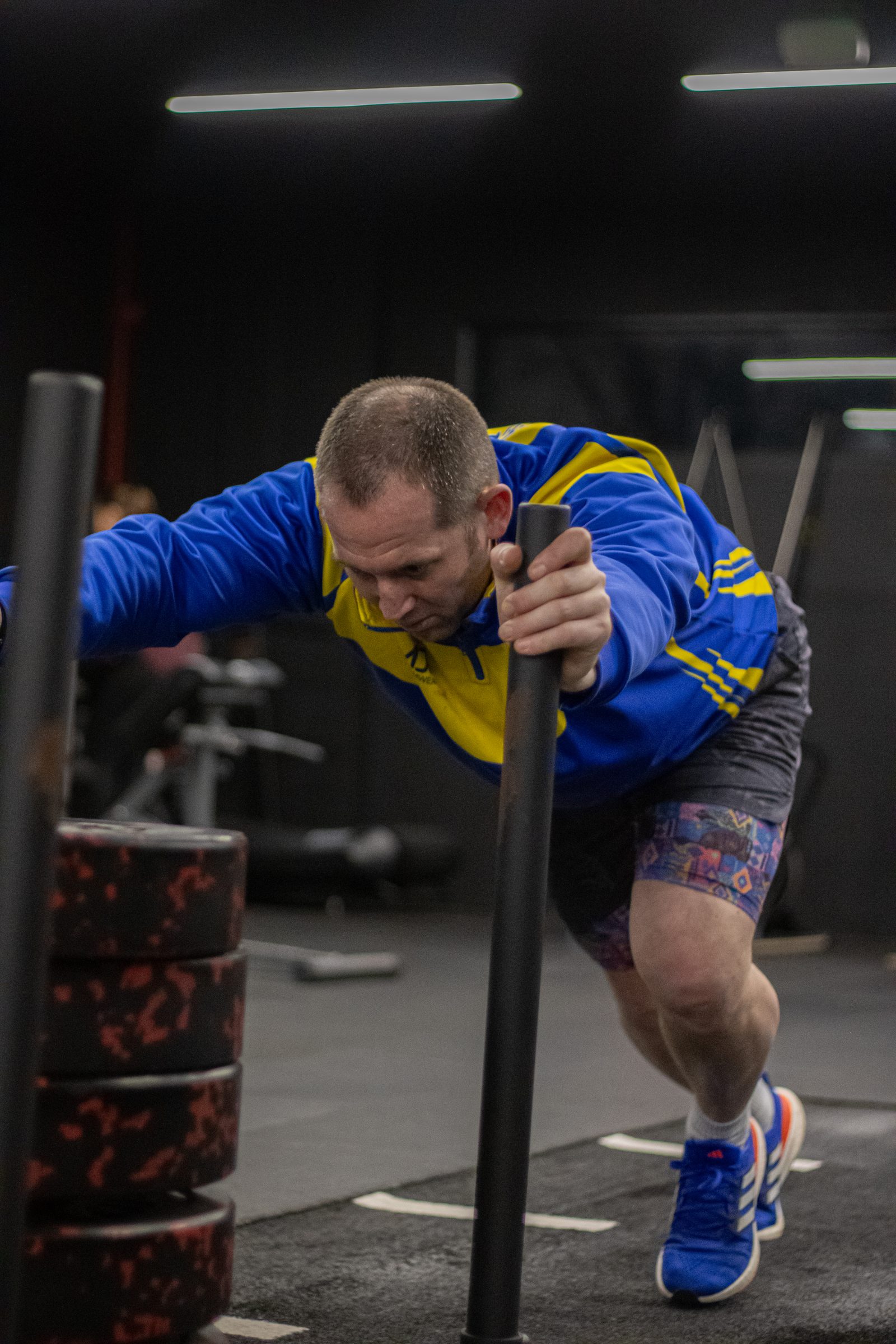 A Primal member driving the sled across the gym in Killingworth